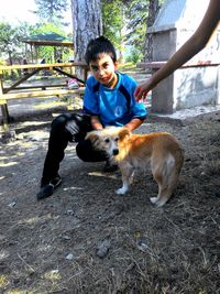 Portrait of young woman with dog