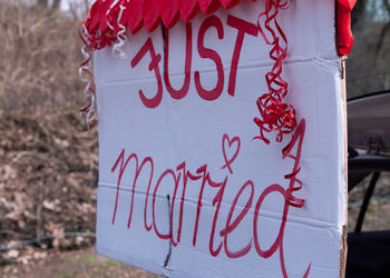 Close-up of text on red heart shape sign