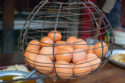 Close-up of brown eggs in basket