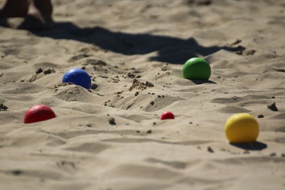 Close-up of multi colored ball on sand