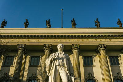 Low angle view of statue against sky