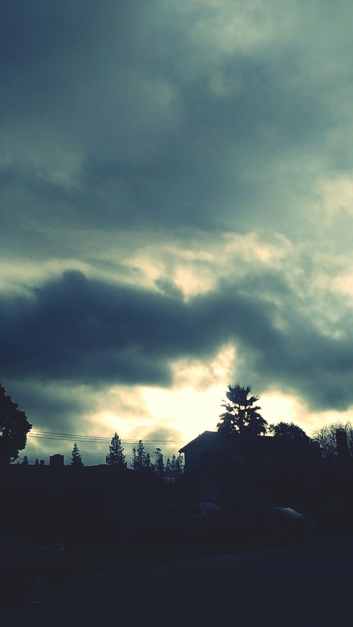 sky, silhouette, cloud - sky, cloudy, tree, sunset, cloud, overcast, weather, tranquility, tranquil scene, dusk, nature, beauty in nature, scenics, dramatic sky, storm cloud, low angle view, landscape, outdoors