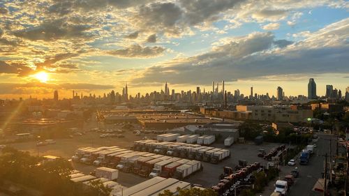 High angle view of brooklyn and manhattan buildings against sky during sunset