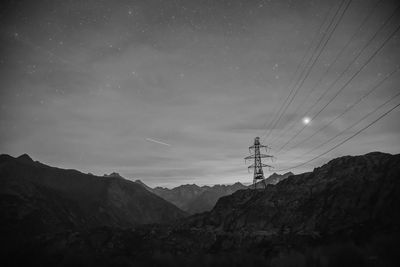 Low angle view of mountain against sky at night