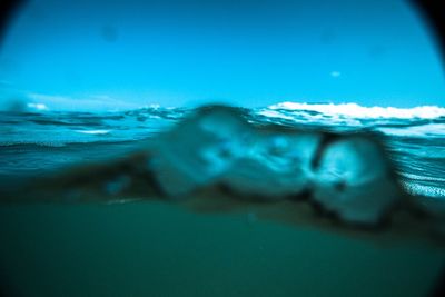 Close-up of man swimming in pool