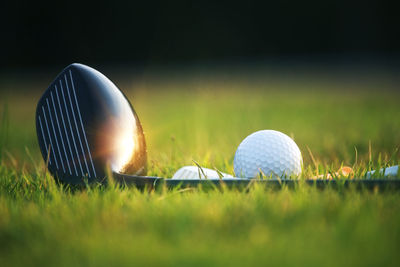 Close-up of golf ball on field