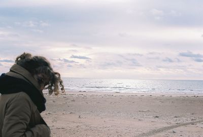 Dog on beach at sunset