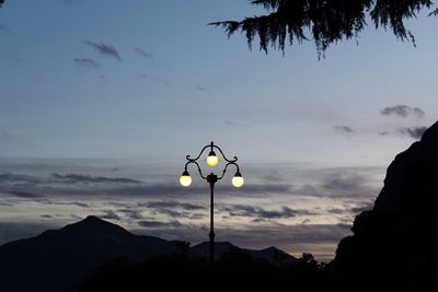 Silhouette trees against sky during sunset