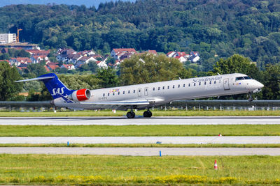 View of airplane at airport runway