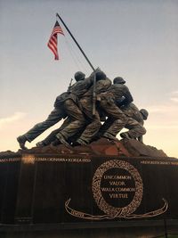 Low angle view of statue against sky