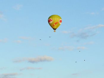 Low angle view of parachute against sky