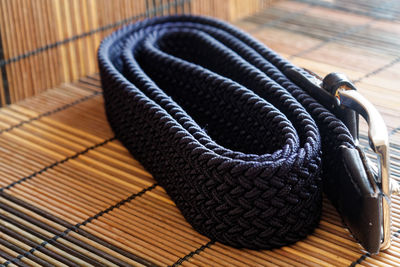 Close-up of belt on place mat