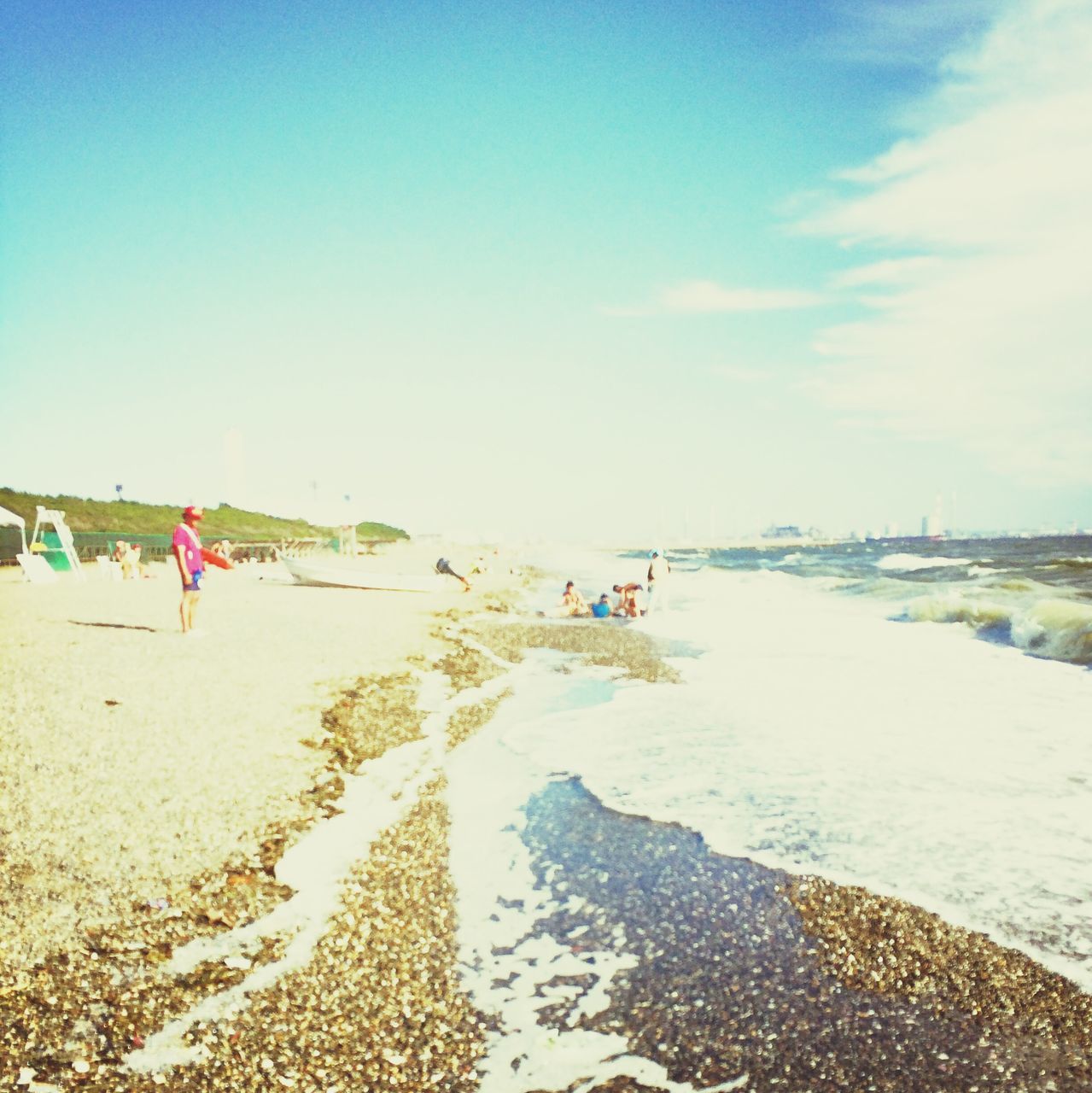 beach, water, sea, sand, shore, leisure activity, lifestyles, vacations, horizon over water, sky, tranquil scene, tranquility, scenics, large group of people, nature, beauty in nature, men, person, day