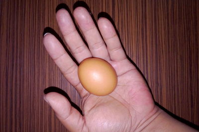 Close-up of hand holding eggs