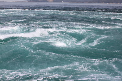 Waves splashing on rocks