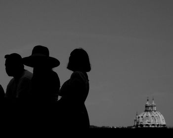 Silhouette of people looking at view