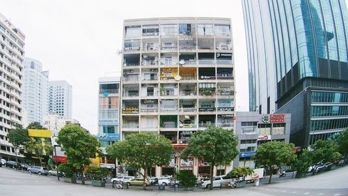 Buildings in city against sky