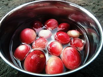 High angle view of strawberries in bowl on table