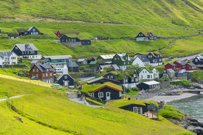 High angle view of houses and buildings on field