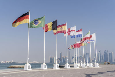 Flags of nations qualified for world cup qatar 2022 hoisted at doha corniche, qatar.