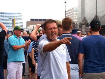 People standing on street in city