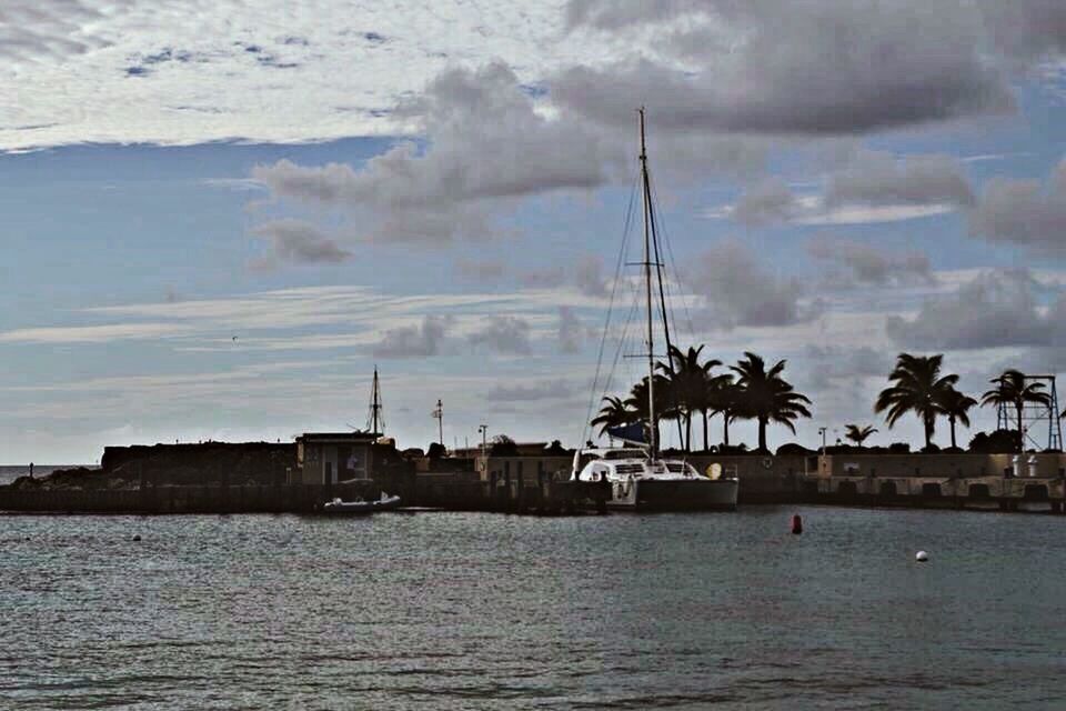 water, waterfront, sea, sky, building exterior, built structure, architecture, cloud - sky, nature, cloudy, nautical vessel, tranquility, river, reflection, outdoors, tranquil scene, weather, scenics, beauty in nature, cloud