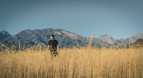 Full length of man on land against sky