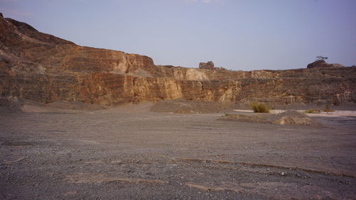 Rock formations in desert against sky