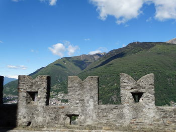 Built structure on mountain against sky