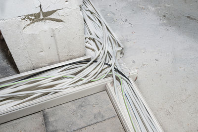 Layed installation of electric cables on the floor in a newly built house. cables lying in plastic.