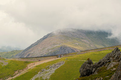 View from ranger path at llanberis path and mountain train to yr wyddfa peak - snowdon in wales. uk