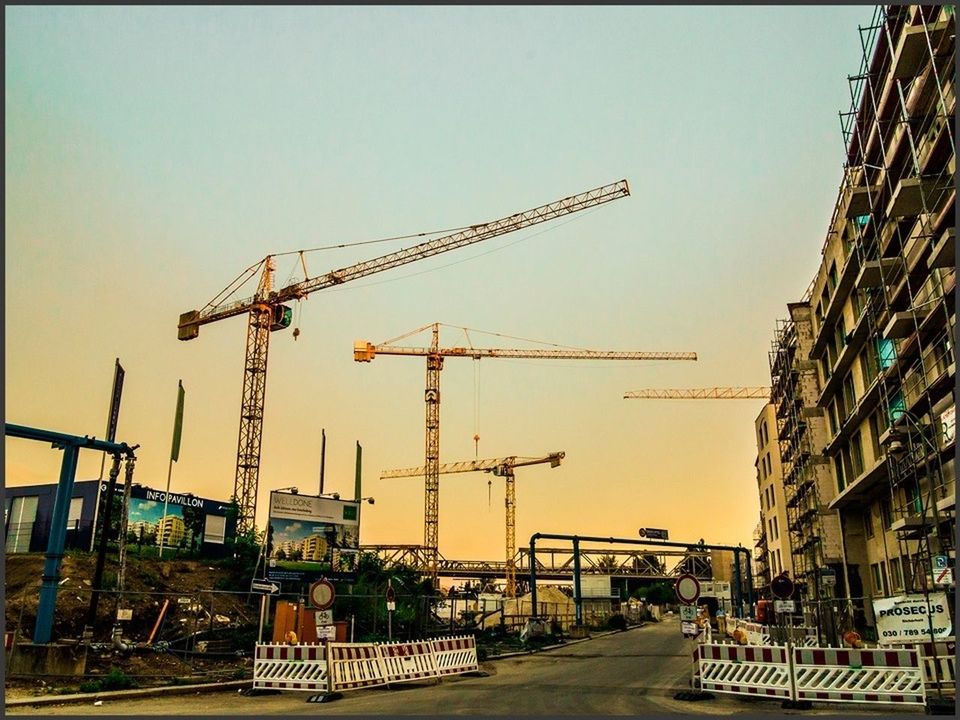 building exterior, built structure, architecture, construction site, clear sky, crane - construction machinery, industry, construction, crane, fuel and power generation, development, construction industry, factory, sky, technology, outdoors, incomplete, copy space, house, electricity pylon