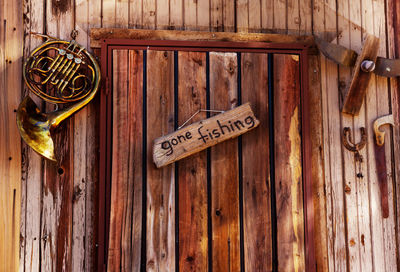 Close-up of text on wooden door