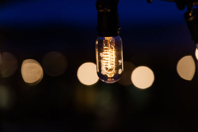 Close-up of illuminated light bulb