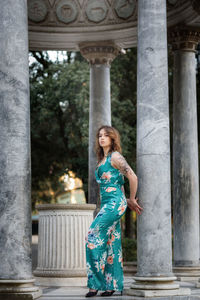 Full length of woman standing in gazebo