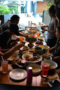 Woman eating food on table