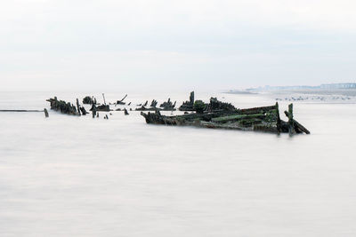 Shipwreck from world war in close distance of a beach in northern france,