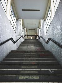 Man on top of staircase at railroad station