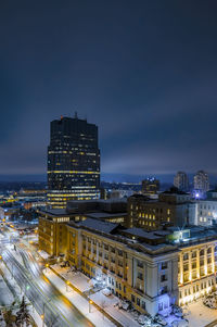 High angle view of city lit up at night