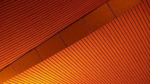 Low angle view of orange ceiling