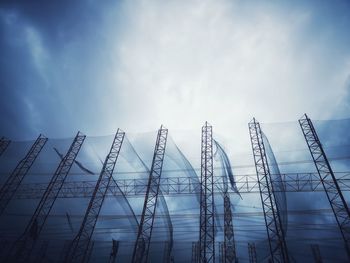 Low angle view of metal structure against sky at construction site