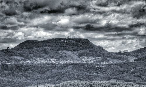 Scenic view of landscape against cloudy sky