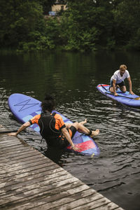 People on boat in lake