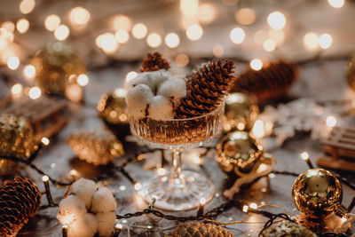 Close-up of illuminated christmas decorations on table