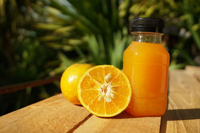 Close-up of orange juice on table