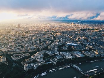 High angle view of cityscape against cloudy sky