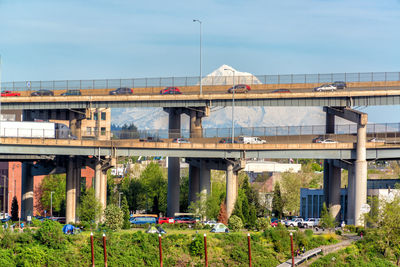 Vehicles moving on bridges against mt hood