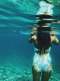 Woman swimming in sea