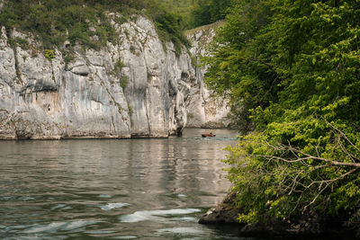 Scenic view of sea against rock formation
