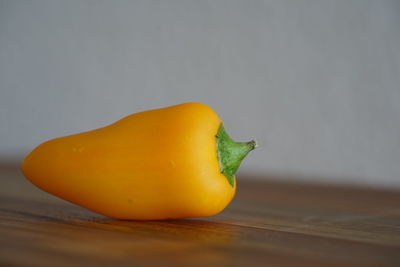 Close-up of yellow bell peppers on table